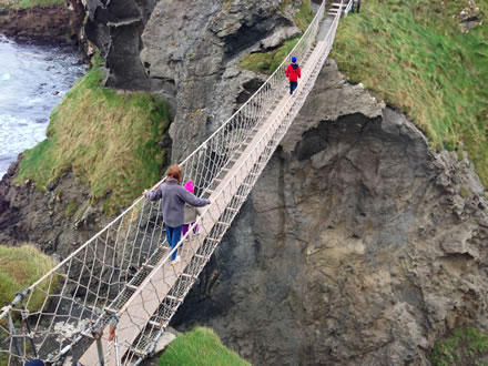 Children crossing Carrick a Rede Rope Bridge